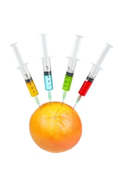 Grapefruit with four syringes