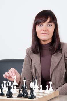 Business women playing chess