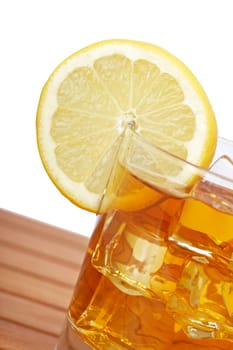 Glass of ice tea with lemon