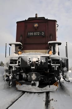 Diesel locomotive of the Harz Narrow Gauge Railway. Behind the locomotive is a snow blower.