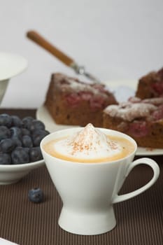 Blueberry pie and cappuccino
