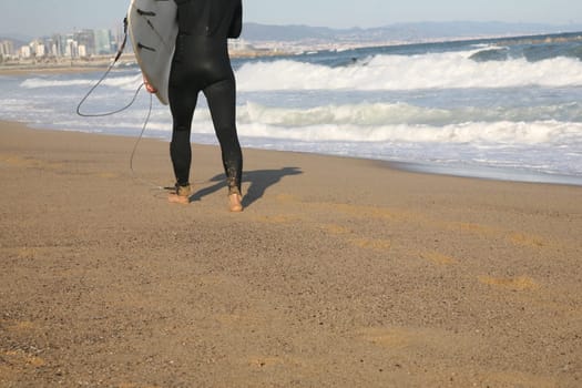 Surfer running on the beach
