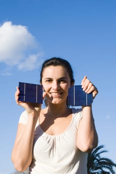 Woman holding solar panels