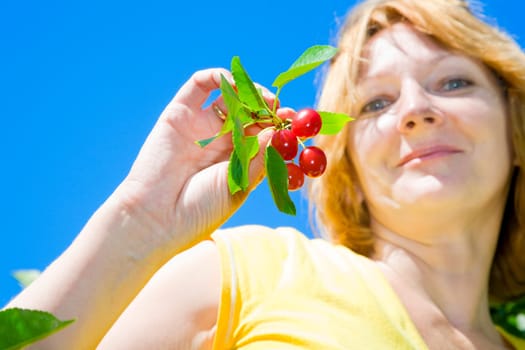 Woman with cherries