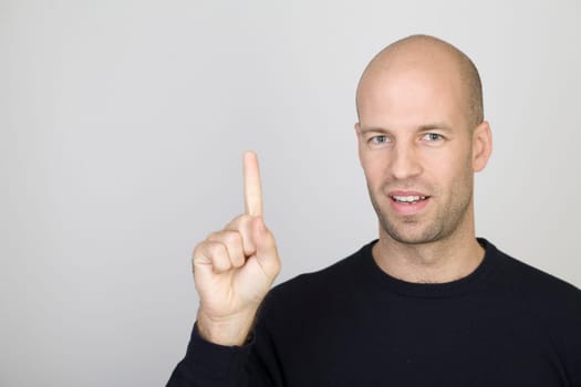 Man showing the number 1 with one finger