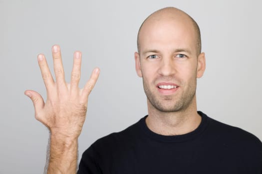 Man showing the number 5 with five fingers