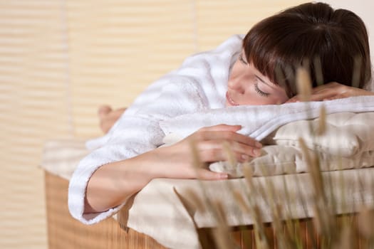 Spa - Young female client at wellness massage
