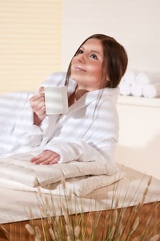 Spa - Young female client at wellness massage