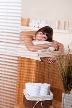 Spa - Young female client at wellness massage