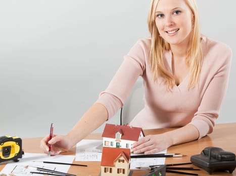 woman architect at her work table