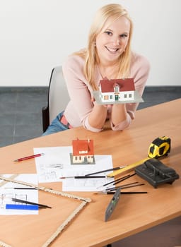 woman architect at her work table