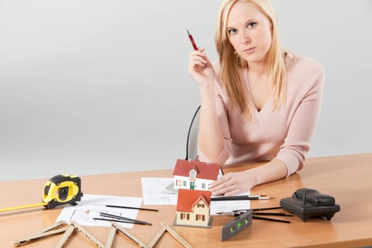 woman architect at her work table