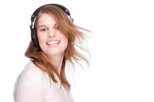 Young woman listens to music