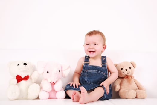 Lovely baby girl with toys