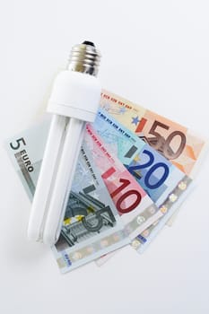 Energy-saving lamp on euro banknotes