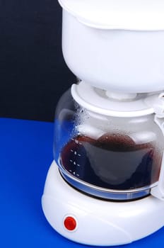 Closeup of white coffee maker.