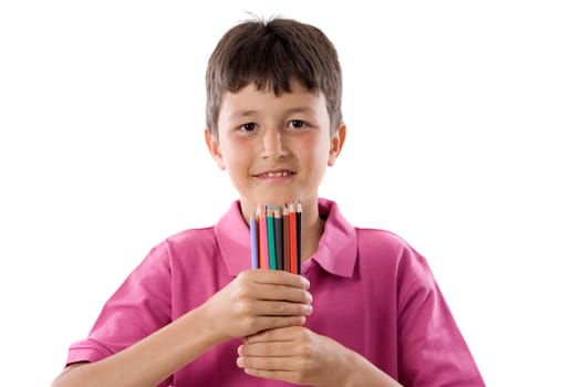Adorable boy with many crayons of colors