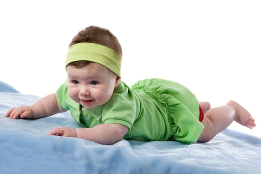 Baby girl smiling lying face down