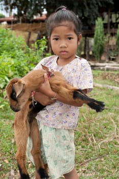 Asian girl with goat
