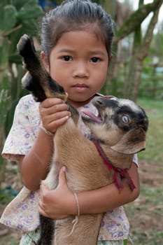 Asian girl with goat