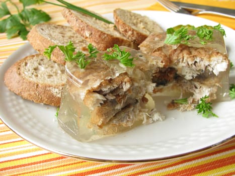 Fried herring in aspic with bread rolls