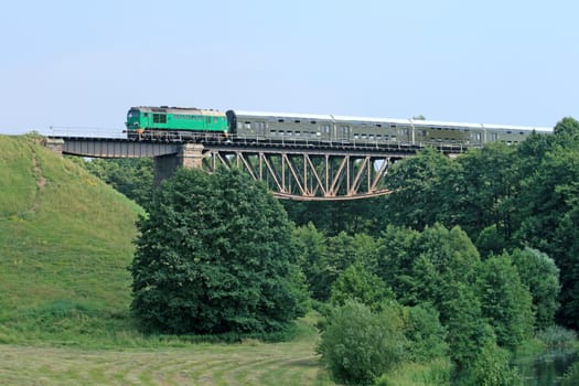 Passenger train passing the bridge