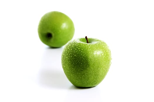 Two fresh green apples