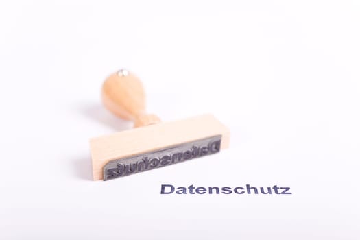 Wooden stamp with the word Privacy Policy