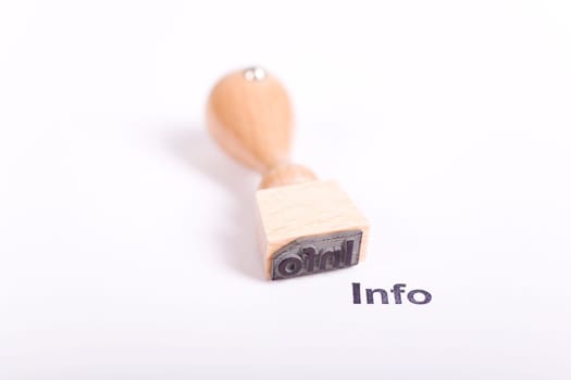 Wooden stamp with the word Info