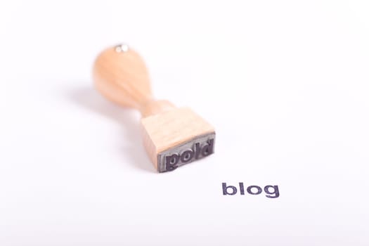 Wooden stamp with the word blog
