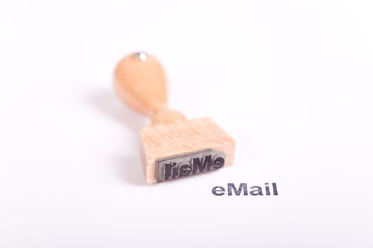 Wooden stamp with the word eMail