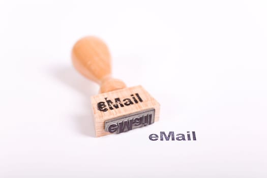 Wooden stamp with the word eMail