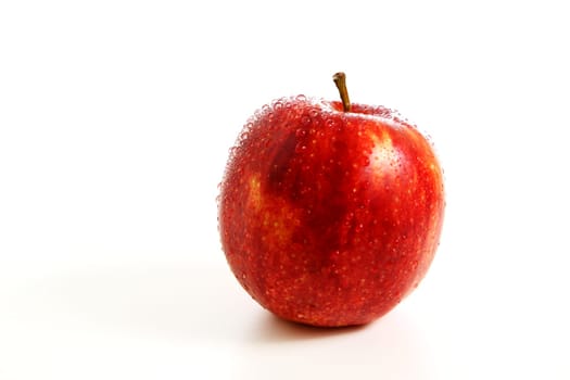 Fresh red apple with water drops