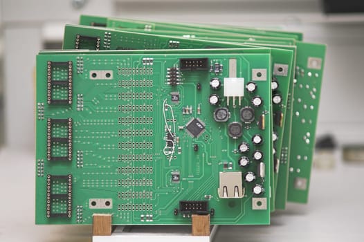 Integrated Circuits in a cradle on a table.