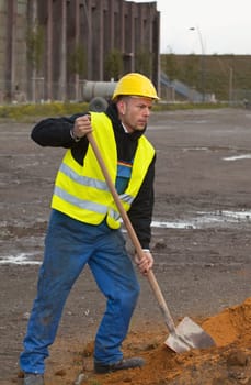 Construction worker digging