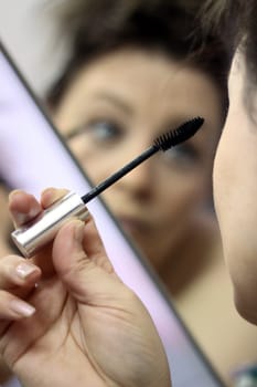 Make-up in front of the mirror
