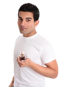 Adult male holding a bottle of aftershave or mens fragrance