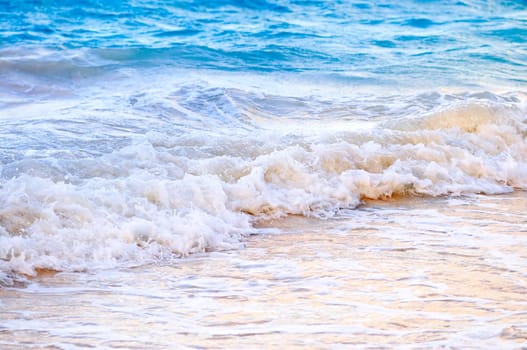 Waves breaking on tropical shore