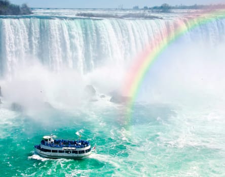 Rainbow and tourist boat at Niagara Falls