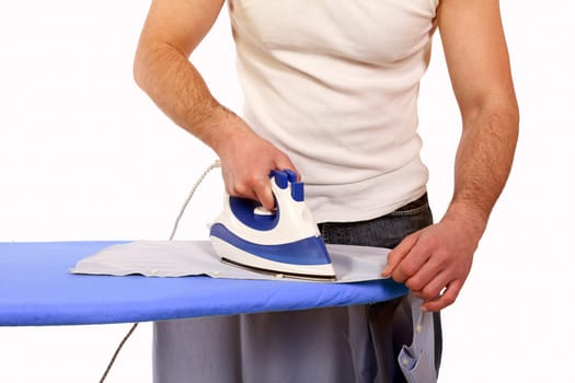 man ironing clothes