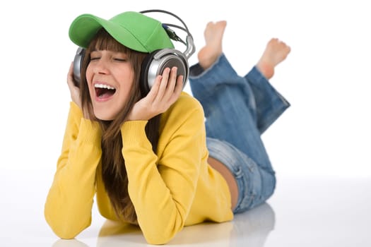 Happy female teenager enjoy music