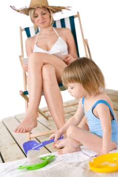 Beach - Young woman  with child