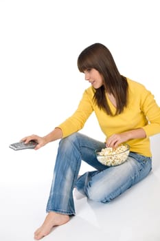 Female teenager watching television