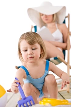 Beach - Young woman with child