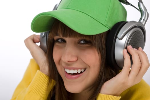 Happy female teenager enjoy music