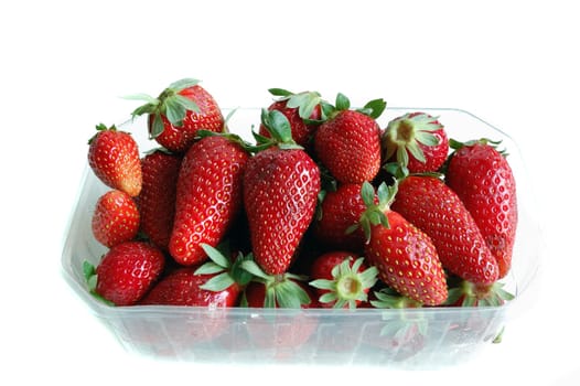 closeup of strawberries isolated against a white background