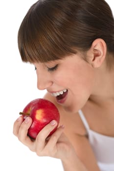 Happy teenager eating healthy apple
