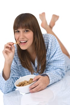 Female teenager eat healthy cereals