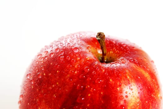Fresh red apple with water drops