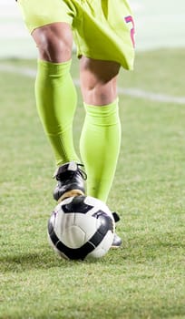 Soccer player with his foot on  the ball